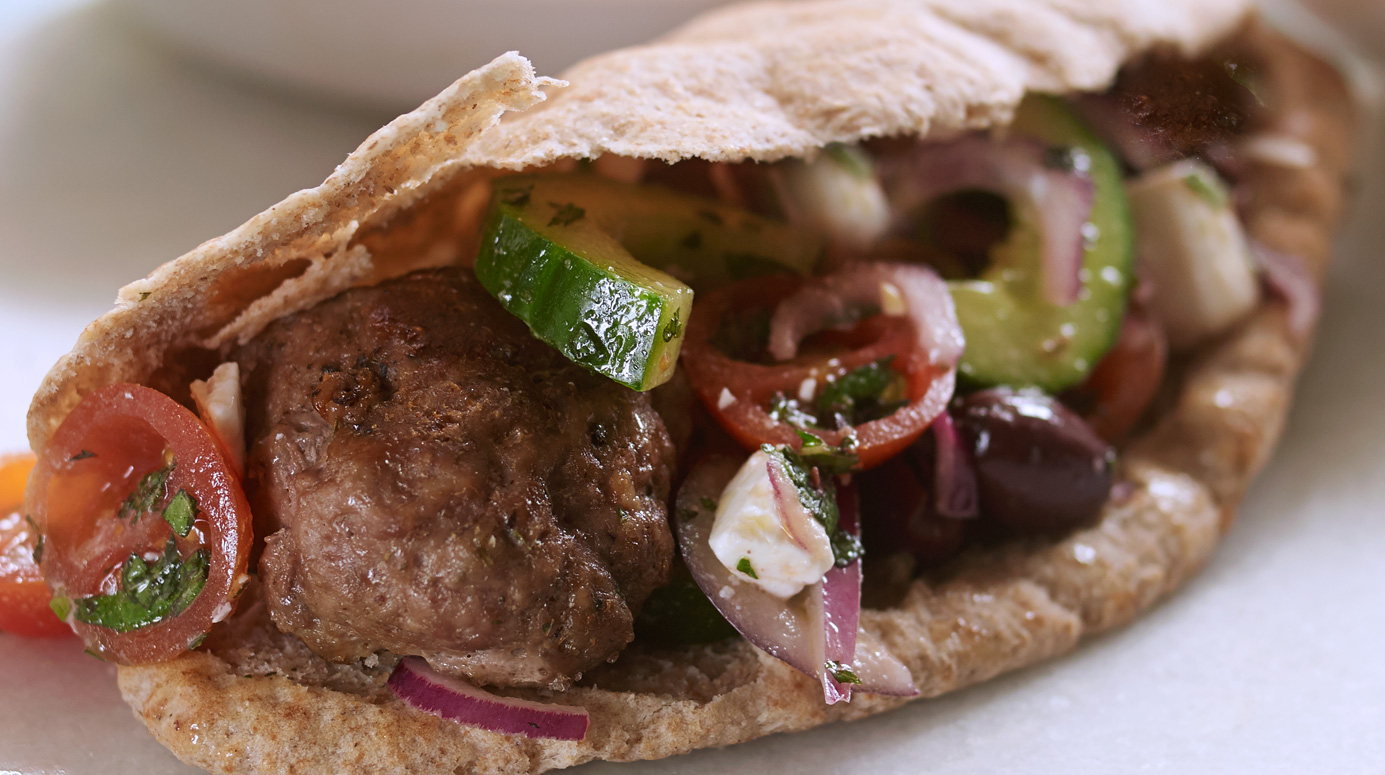 Lamb kebabs, Greek salad and pitta bread