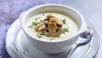 Keto Ready Cauliflower Soup topped with Mushrooms