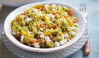 Moroccan vegetable couscous salad with orange and raisins